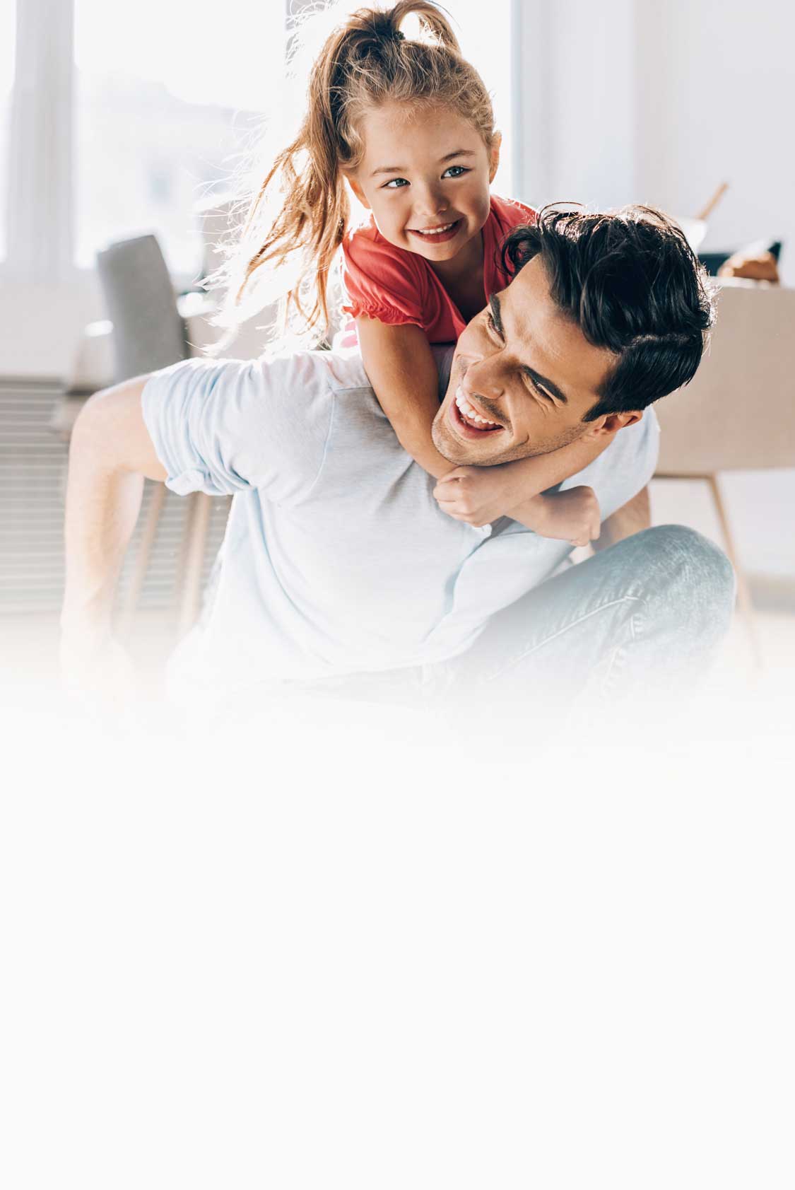 Father playing with his little girl at home