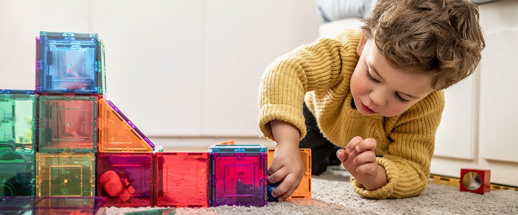 Boy playing with building Blocks