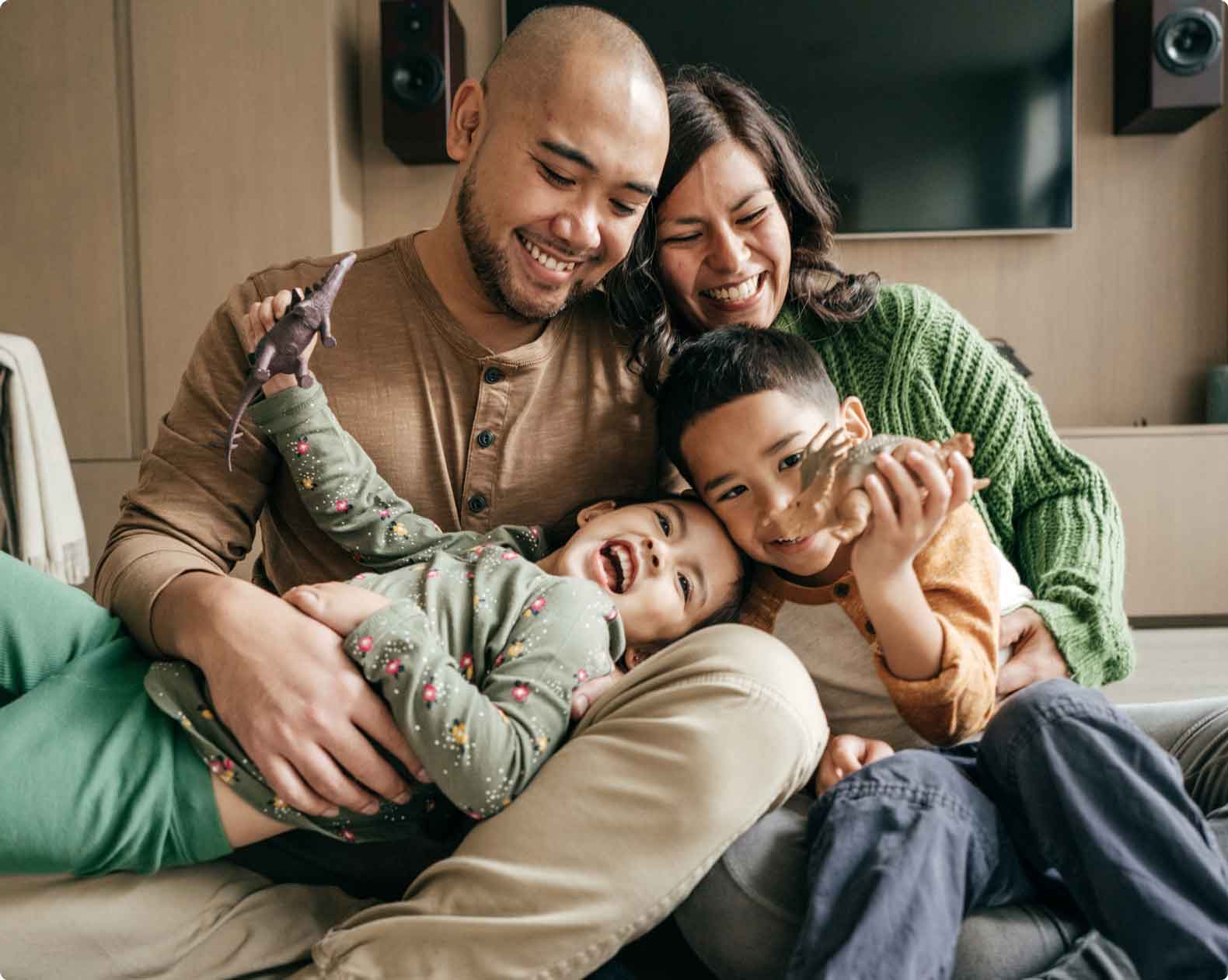 Hispanic family having fun in living room