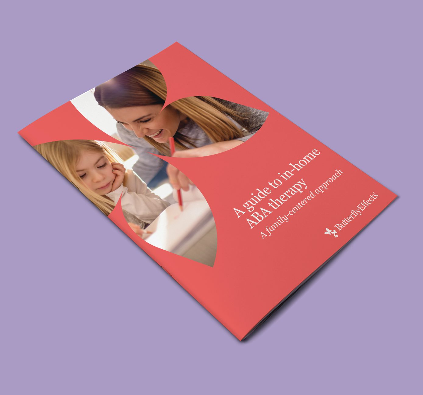red booklet titled A Guide to in-home ABA therapy on a purple background