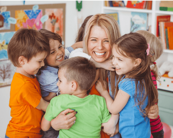 kids smiling with teacher