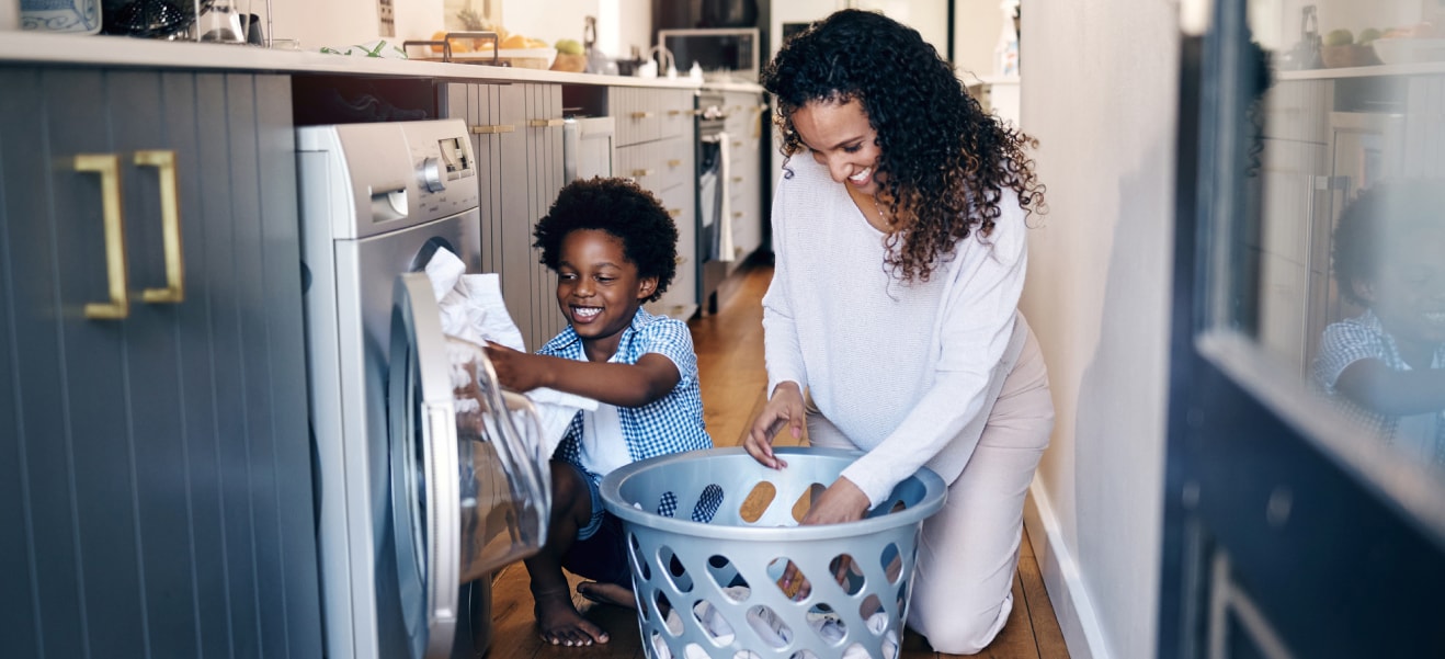 A child practicing daily living skills under a therapist’s guidance