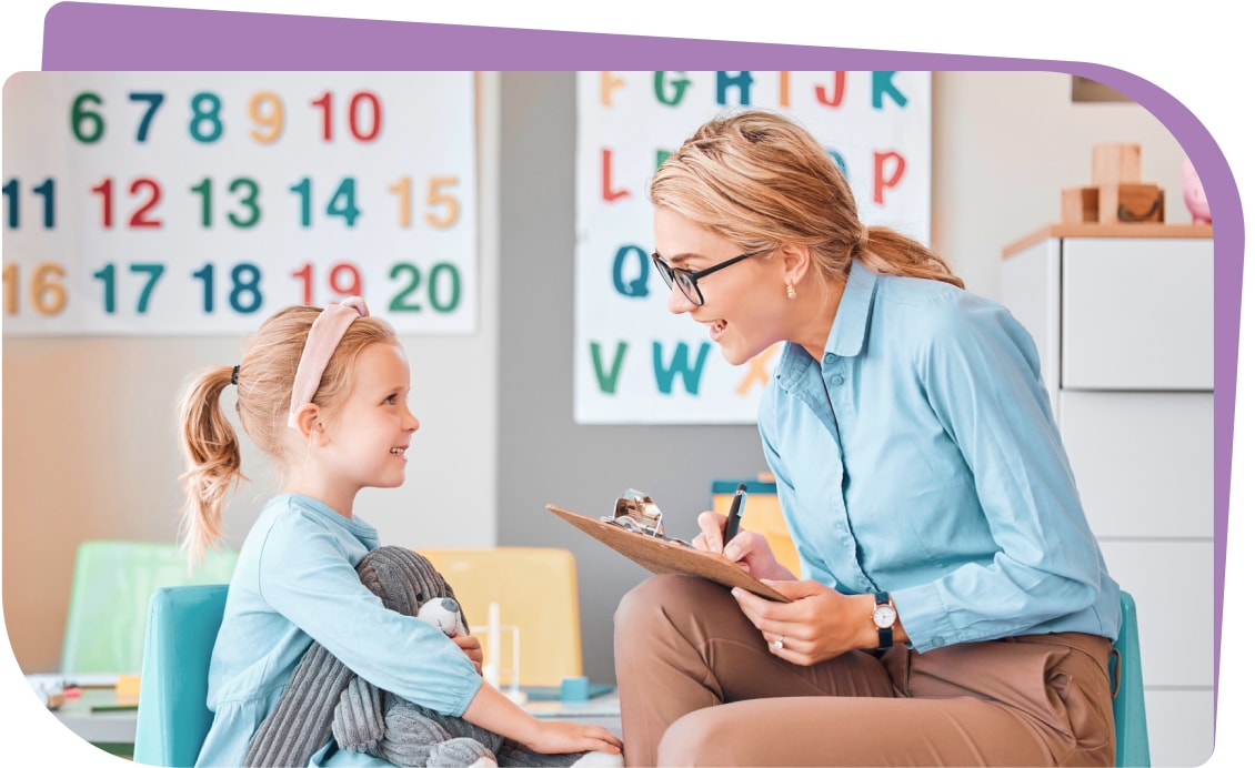 A therapist reviewing assessment notes, highlighting the ABA therapy evaluation process