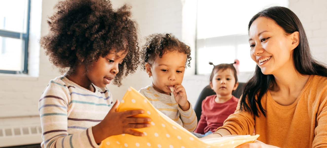 A therapist working closely with a young child, highlighting early intervention methods