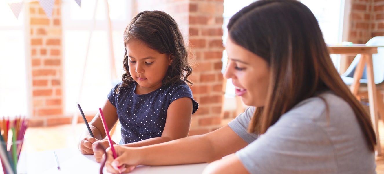 A therapist performing an ABA assessment with a young child in a structured setting