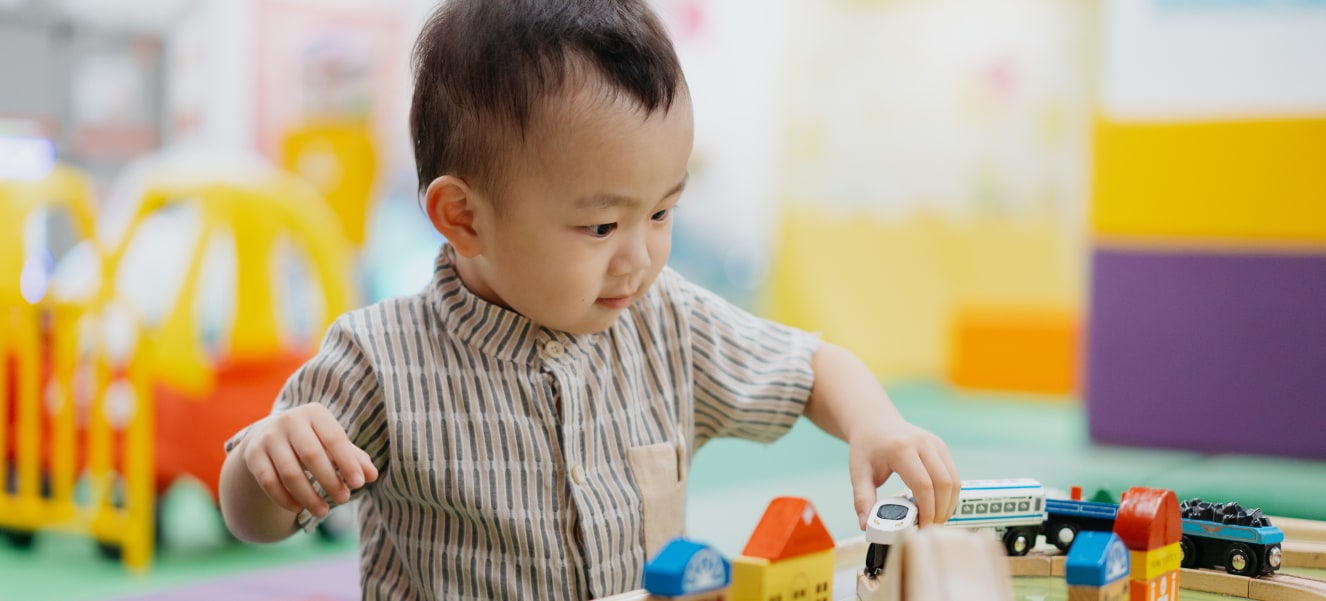 A therapist working with a young child, emphasizing the importance of early intervention